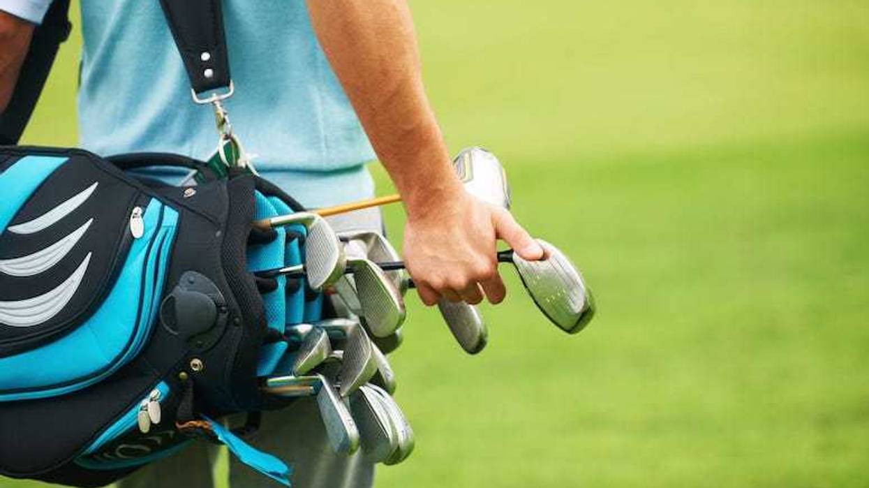 Golfer selecting club