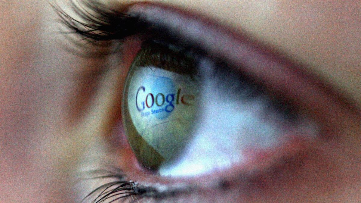 Google logo is reflected in the eye of a girl