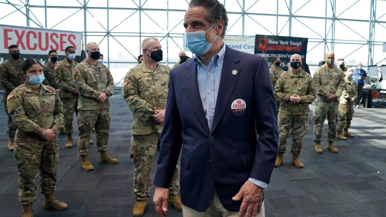 Gov. Andrew Cuomo talks with members of the National Guard during an event at the Jacob K. Javits Convention Center as he announces the start of the statewide "Vaccinate NY" ad campaign to encourage all New Yorkers to get vaccinated, on April 6, 2021 in New York City
