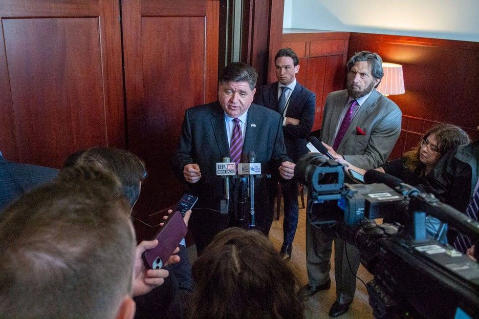 Gov. JB Pritzker speaks to reporters following an event at the Illinois State Library in Springfield on Wednesday, May 28, 2025. Pritzker pledged to veto any budget with "broad-based" tax increases.