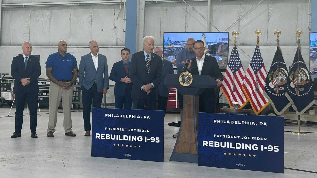 Gov. Josh Shapiro (right) addresses media on the timeline for reopening I-95, while appearing with President Joe Biden at Philadelphia International Airport.