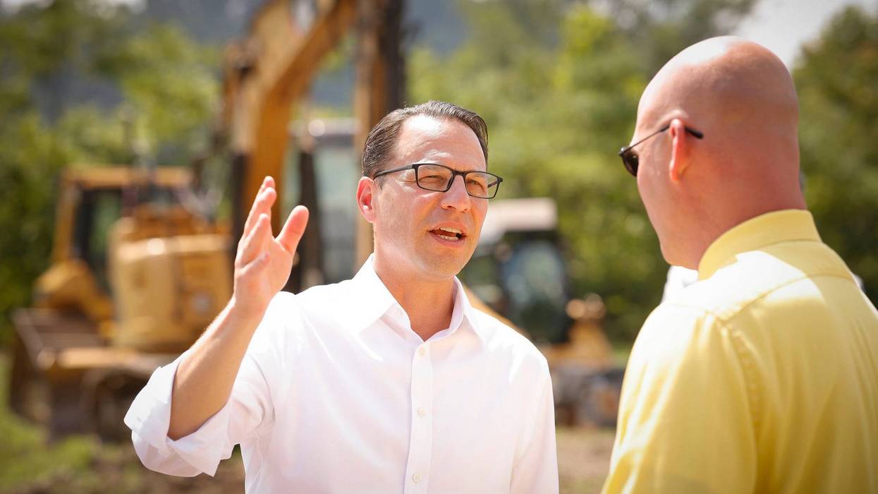 Gov. Josh Shapiro tours a construction project in Pittsburgh.