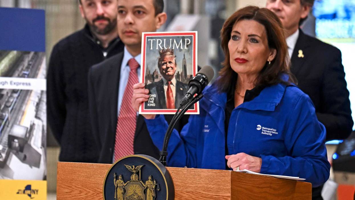 Gov. Kathy Hochul holds a picture of President Donald Trump during a press conference at Grand Central Terminal on February 19, 2025