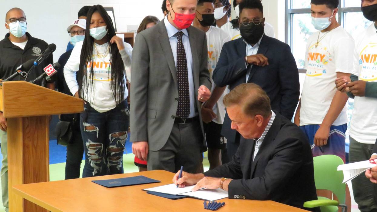 Gov. Ned Lamont signs An Act Concerning Equitable Access to Broadband, with House Speaker Matt Ritter and Rep. Brandon McGee, at the Parker Memorial Community Center in Hartford, 8/5/21