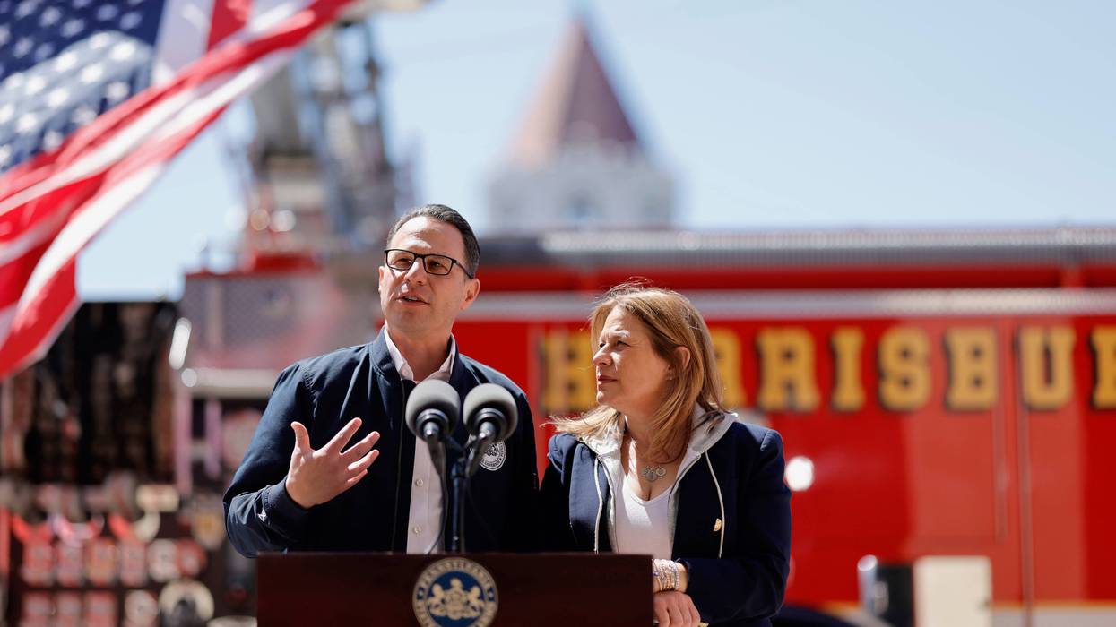 Governor Josh Shapiro and First Lady Lori Shapiro speak at Harrisburg Fire Station 1 on Thursday.