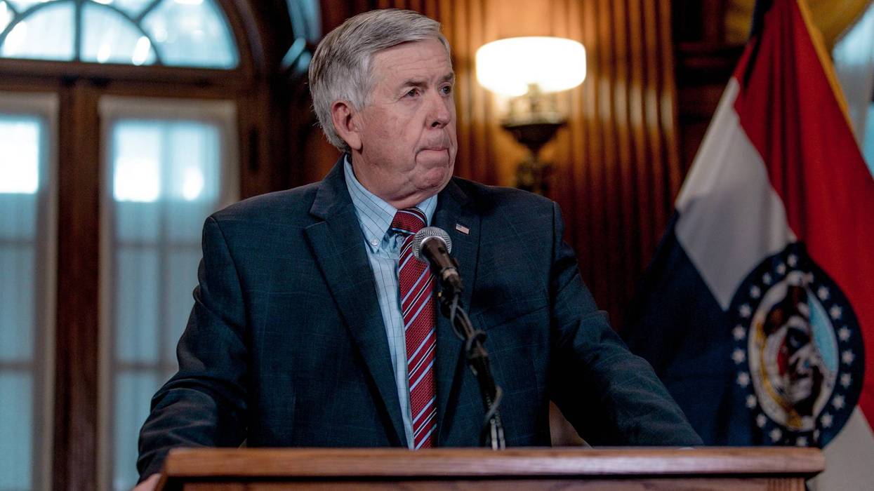 Governor Mike Parson stands at a podium