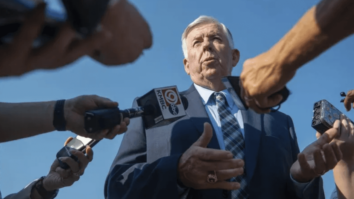Governor Mike Parson with microphones in his face