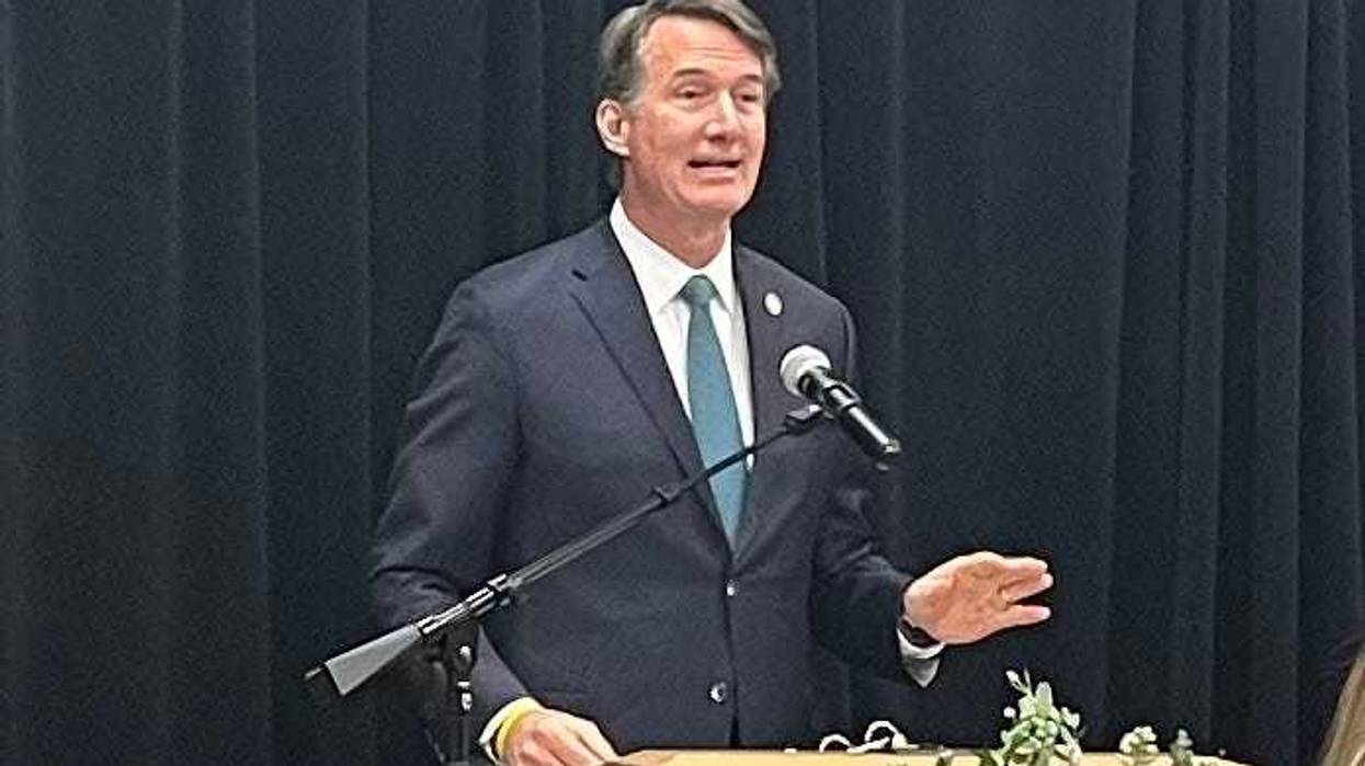 Governor Youngkin stands at a lectern, addressing a crowd