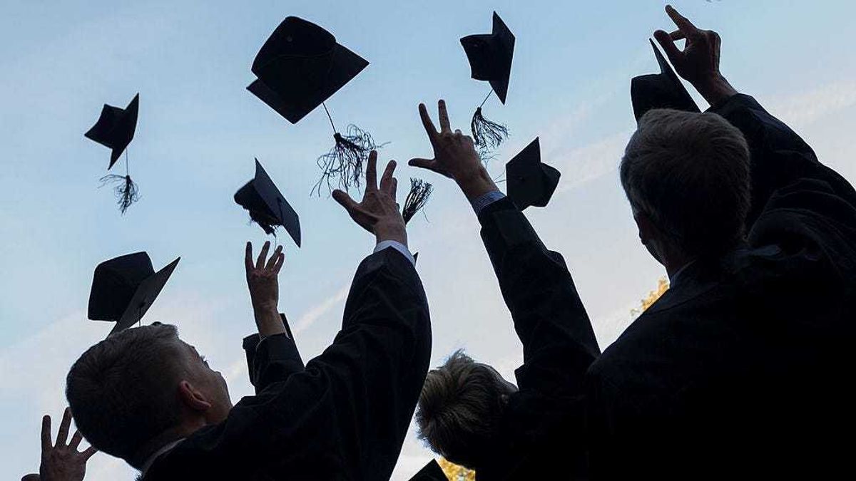 Graduates in gown and caps celebrate their graduation at the HHL Leipzig Graduate School of Management on August 30, 2014 in Leipzig, Germany.