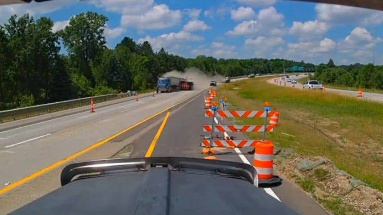Gravel hauler hits work truck on US-127
