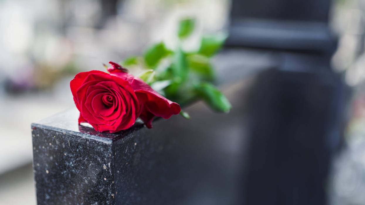 Gravestone with rose