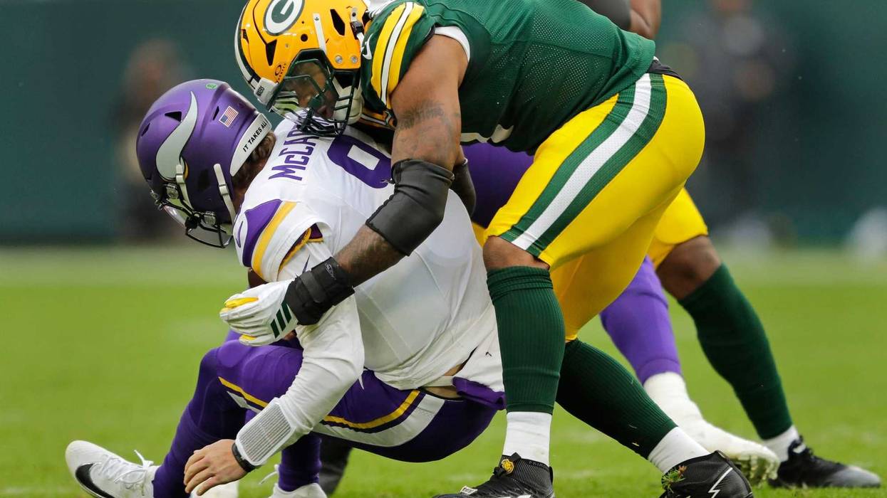 Green Bay Packers defensive end Micah Parsons (1) sacks Minnesota Vikings quarterback J.J. McCarthy (9) during their football game Sunday, November 23, 2025, at Lambeau Field in Green Bay, Wisconsin.