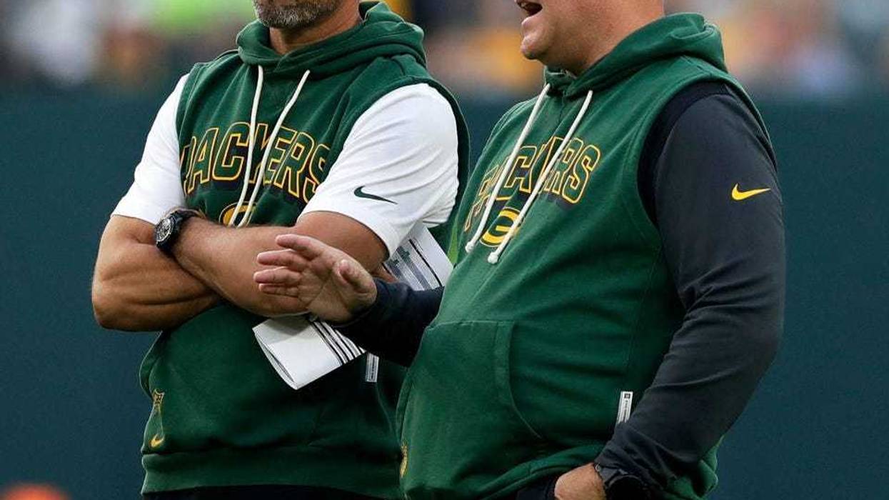 Green Bay Packers Head Coach Matt LaFleur and General Manager Brian Gutekunst talk on the field during Green Bay Packers Family Night on Aug. 2, 2025, at Lambeau Field in Green Bay, Wis.
