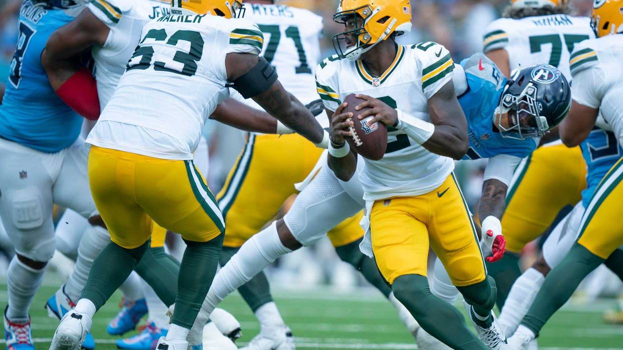 Green Bay Packers quarterback Malik Willis (2) is forced out of the pocket against the Tennessee Titans during their game at Nissan Stadium in Nashville, Tenn., Sunday, Sept. 22, 2024.
