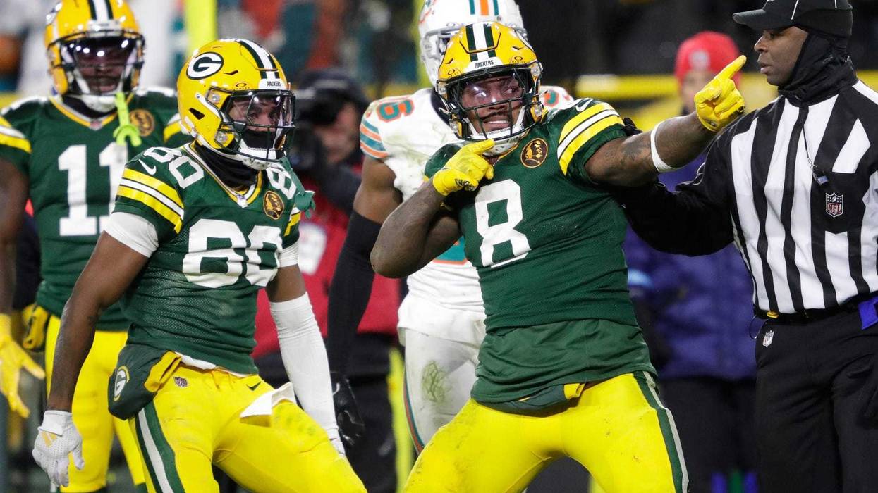 Green Bay Packers running back Josh Jacobs (8) celebrates after a long reception and run in the fourth quarter against the Miami Dolphins during their football game Thursday, November 28, 2024, at Lambeau Field in Green Bay, Wisconsin. Dan Powers/USA TODAY NETWORK-Wisconsin.