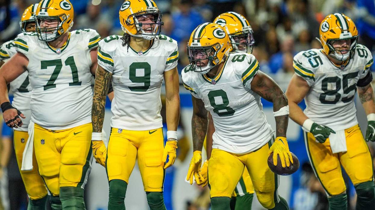Green Bay Packers running back Josh Jacobs (8) celebrates his touchdown with teammates, during the Thursday Night Football game against the Detroit Lions at Ford Field in Detroit on Thursday, Dec. 5, 2024.
