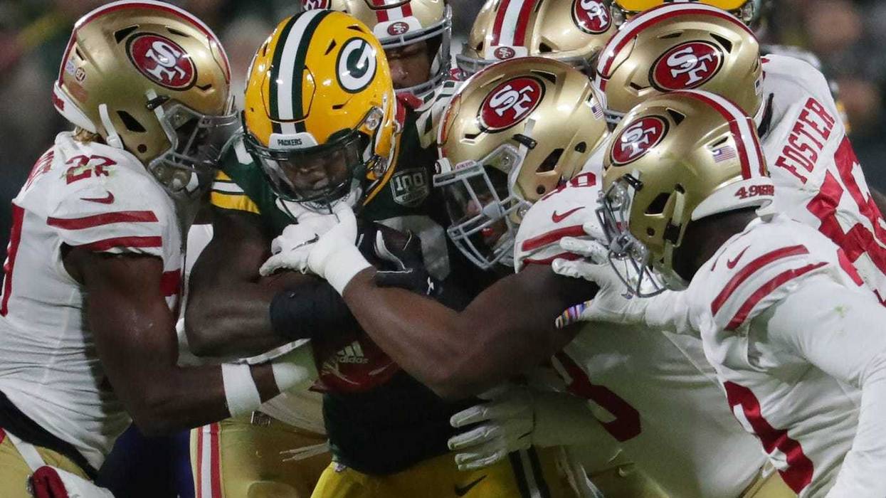 Green Bay Packers running back Ty Montgomery (88) is swarmed by he San Francisco 49ers defense during the second quarter of their game Monday, October 15, 2018, at Lambeau Field in Green Bay, Wis. The Green Bay Packer beat the San Francisco 49ers 33-30.