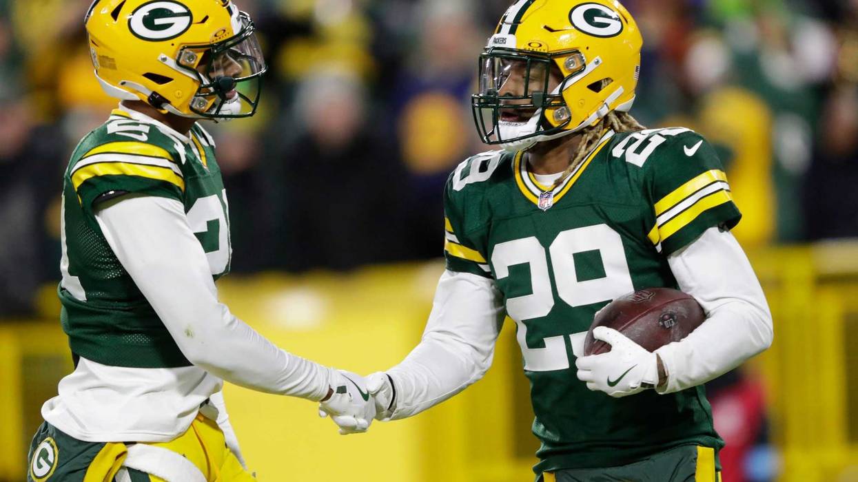 Green Bay Packers safety Xavier McKinney (29) celebrates with cornerback Carrington Valentine (24) after intercepting a pass against San Francisco 49ers quarterback Brandon Allen during their game on Sunday, Nov. 24, 2024, at Lambeau Field in Green Bay, Wisconsin. It was McKinney's seventh interception of the season.