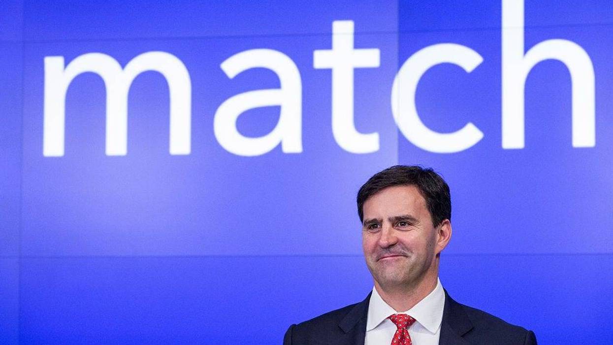 Greg Blatt, chairmain of Match Group, celebrates the company's initial public offering (IPO) at the NASDAQ stock exchange on November 20, 2015 in New York City. The company began trading on the NASDAQ yesterday morning with an IPO of $12 per share. (Photo by Andrew Burton/Getty Images)