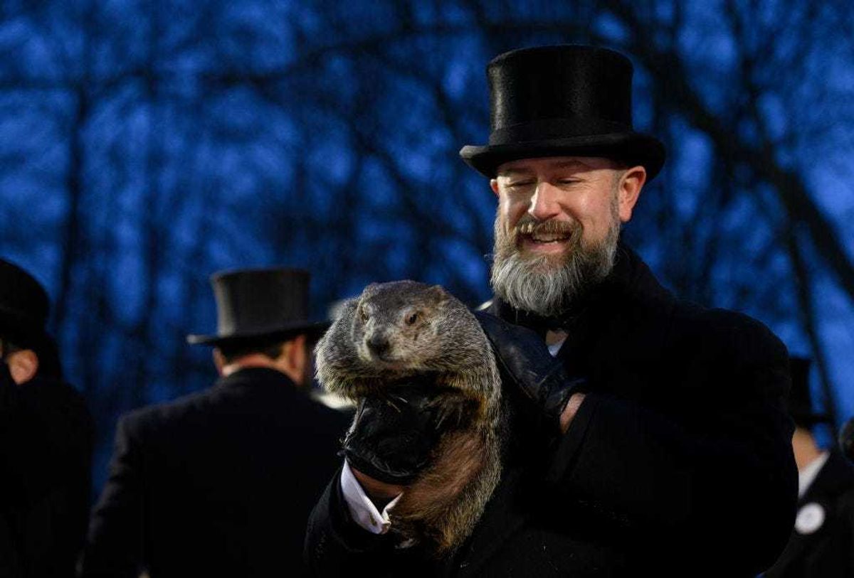 Groundhog handler AJ Dereume holds Punxsutawney Phil after he did not see his shadow predicting an early Spring during the 138th annual Groundhog Day festivities on Friday February 2, 2024 in Punxsutawney, Pennsylvania.
