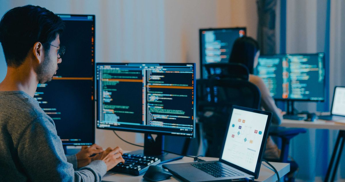 Group Adult Asia male, female freelance typing write prompt AI bot IT app smart program nomad, video game, terminal with coding language, designer, big data center on computer in night office