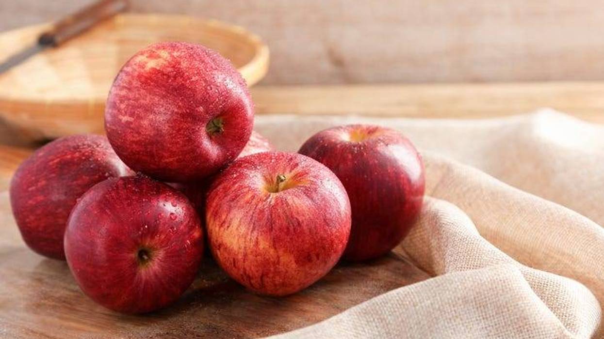 Group of Gala Apples on wooden board background