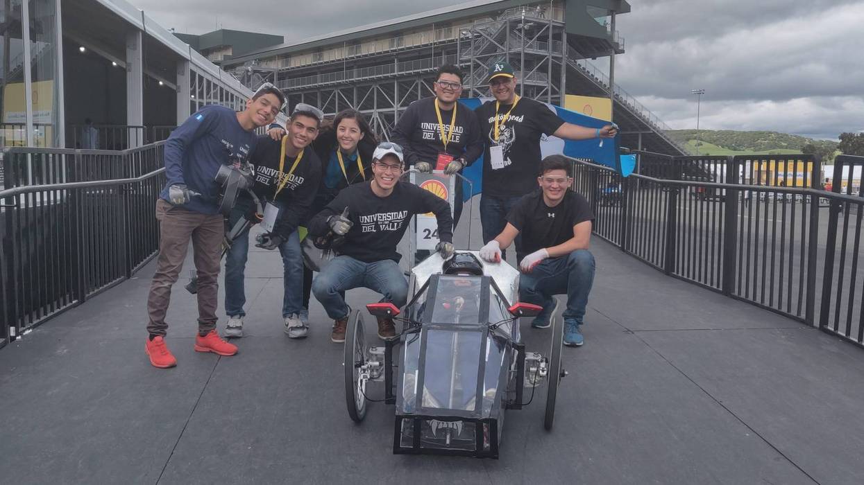 Guatemalan engineering students show off their entry into the Shell Eco-Marathon at Sonoma Raceway.