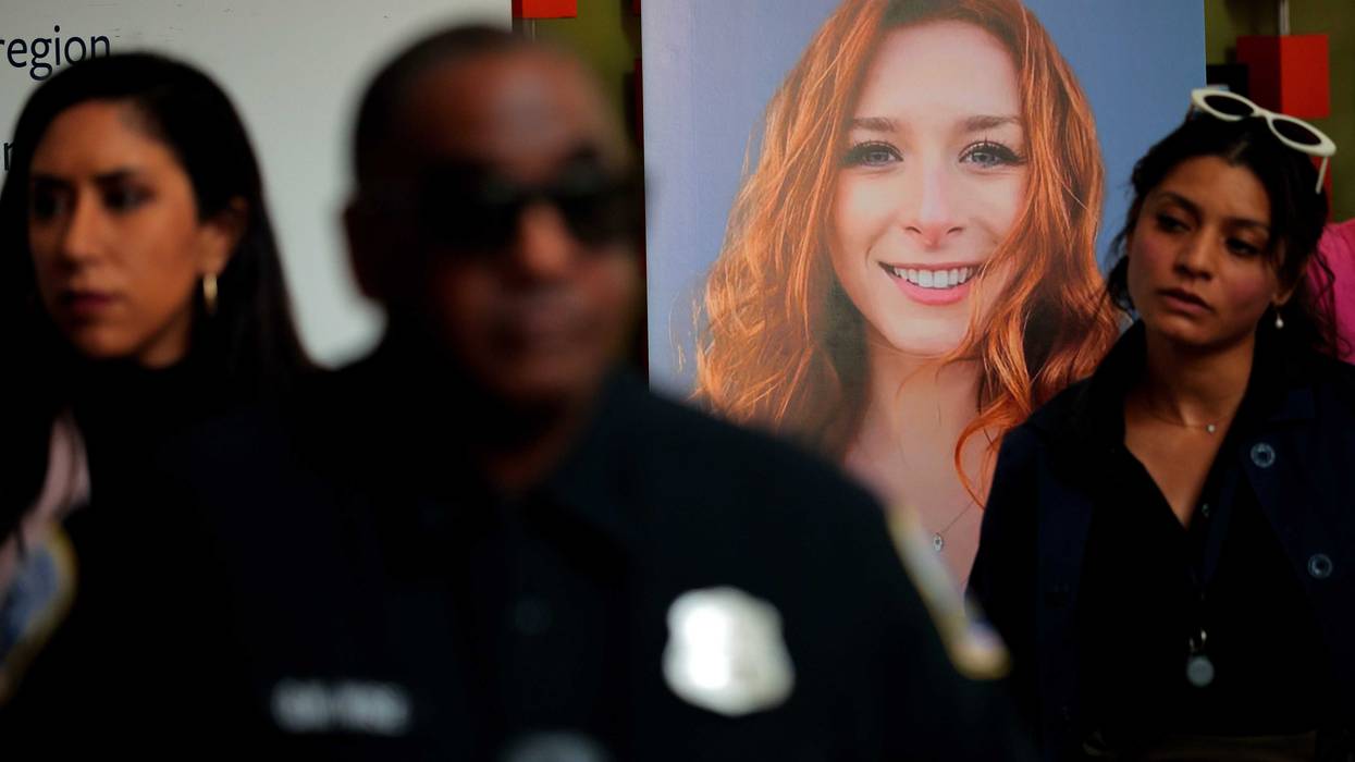 Guests gather near a photograph of Sarah Lynn Milgrim during a remembrance and reopening ceremony at the Lillian and Albert Small Capital Jewish Museum on May 29, 2025 in Washington, DC.