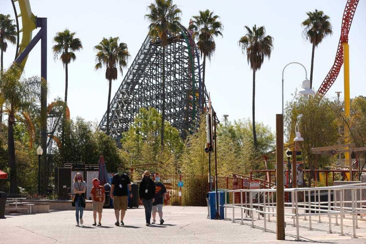 Guests walk through Six Flags Discovery Kingdom on April 01, 2021 in Vallejo, California.