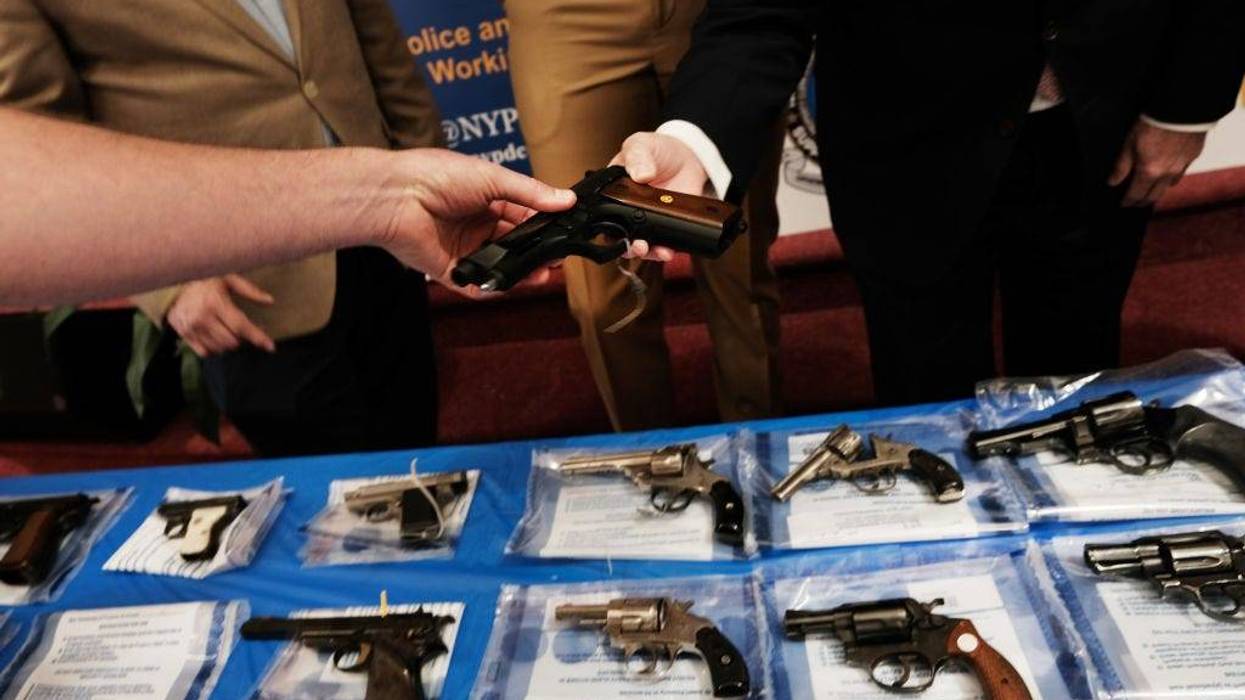 Guns are displayed on a table during a gun buy-back event at a church in Staten Island on April 24, 2021 in New York City.