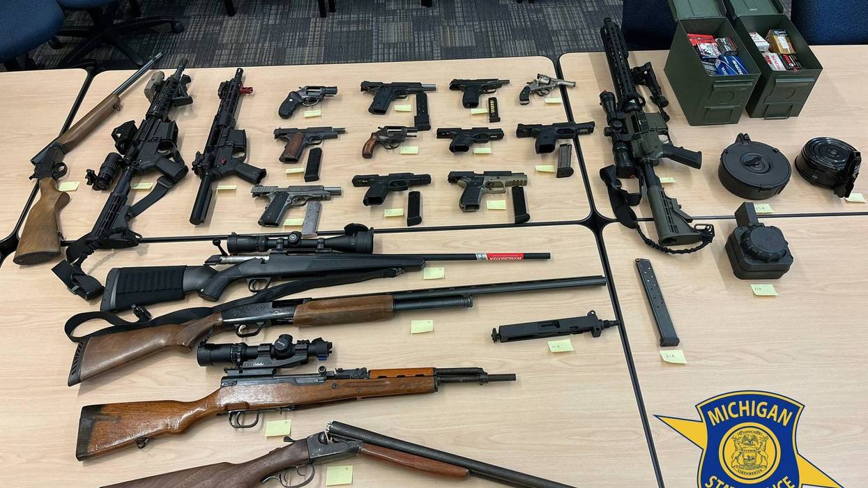 Guns lined up on a table