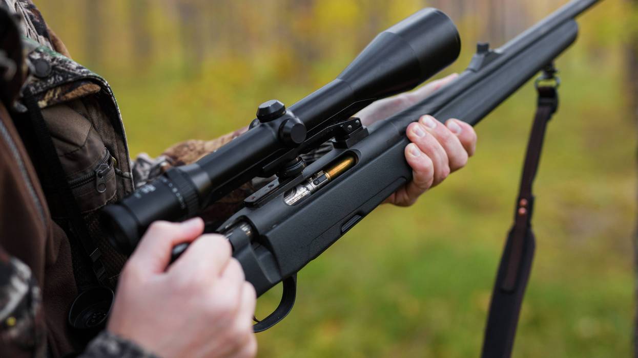 guy holding a semiautomatic rifle