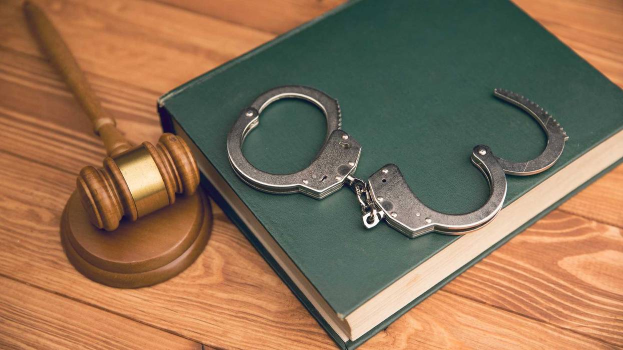 hammer and handcuffs on the table