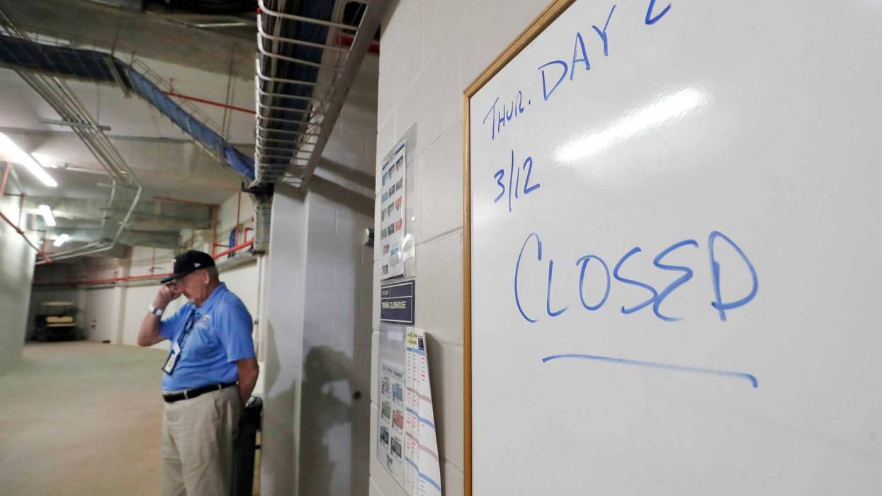 Hammond Stadium worker Paul Francis stands outside the Minnesota Twins' clubhouse after a game between the Twins and the Baltimore Orioles was canceled Thursday, March 12, 2020, in Fort Myers, Fla. Major League Baseball has suspended the rest of its sprin