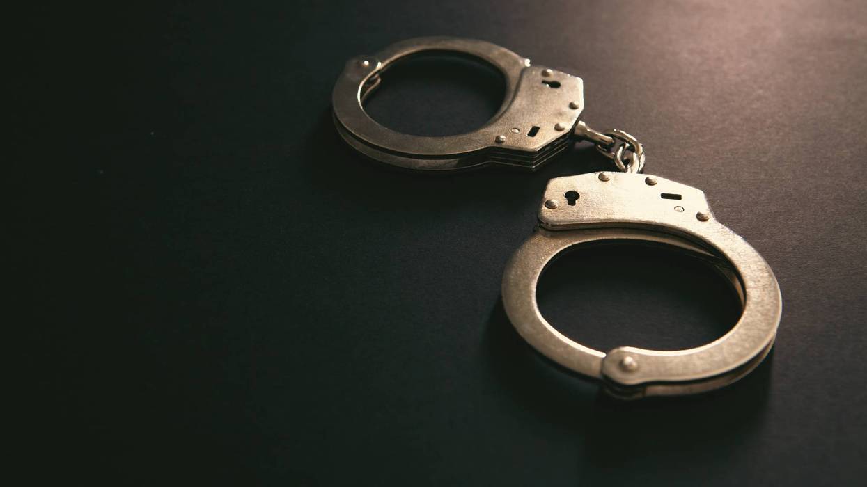 Handcuffs on a black background. Close-up
