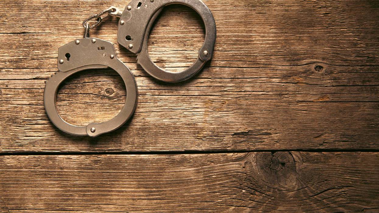 handcuffs on a wooden background