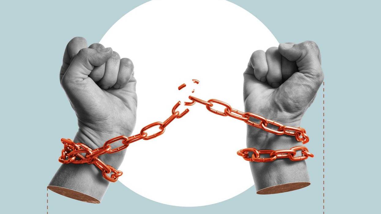 Hands with broken chains, showing freedom from abduction.