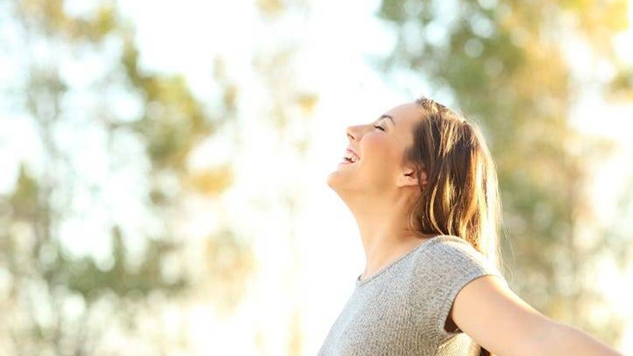 happy woman enjoying the outdoors on a nice day