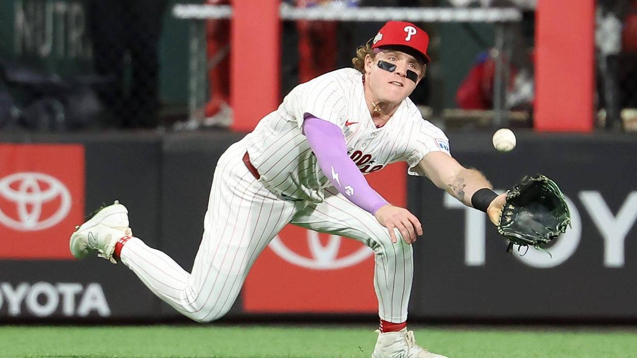 Harrison Bader #2 of the Philadelphia Phillies dives to make a catch in centerfield in the fifth inning against the Los Angeles Dodgers
