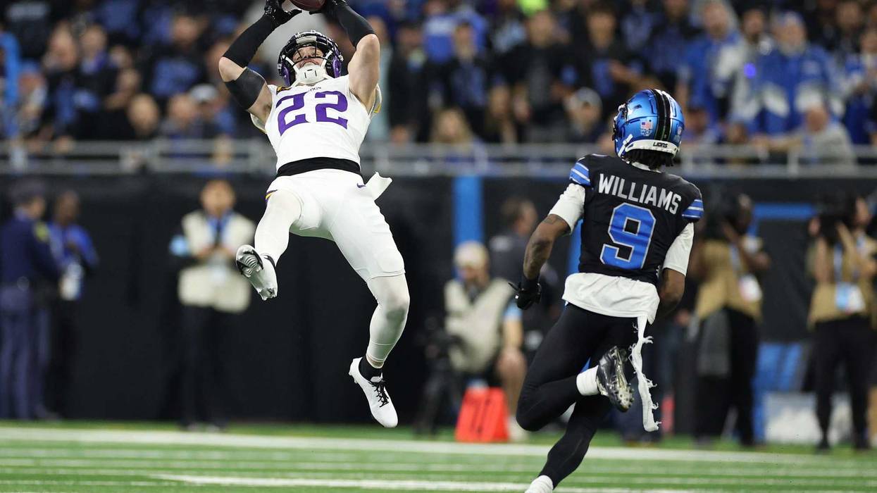 Harrison Smith #22 of the Minnesota Vikings intercepts a pass intended for Jameson Williams #9 of the Detroit Lions during the third quarter at Ford Field on January 05, 2025 in Detroit, Michigan.