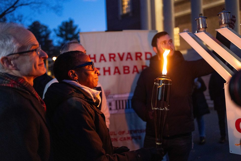 Harvard President Claudine Gay attends a menorah lighting ceremony on the seventh night of Hanukkah with the University