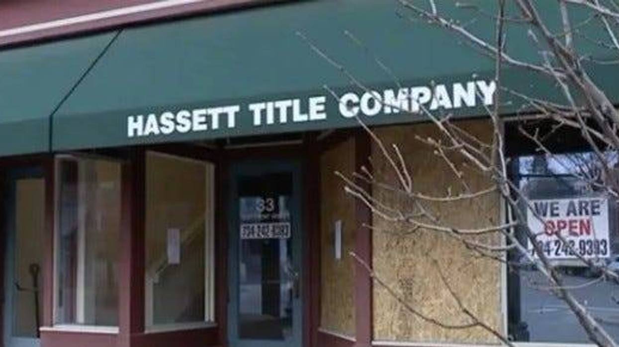Hassett Title Company with boarded up windows