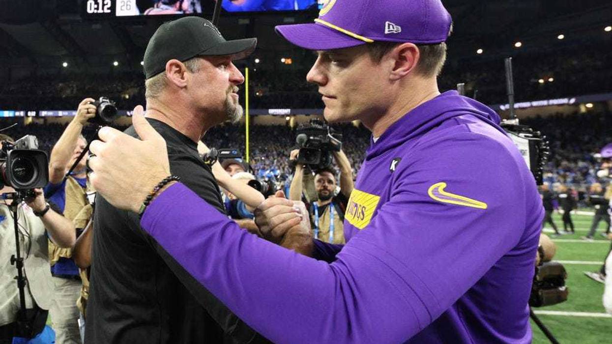 Head coach Dan Campbell of the Detroit Lions and Head coach Kevin O’Connell of the Minnesota Vikings embrace after the game at Ford Field on January 05, 2025 in Detroit, Michigan.