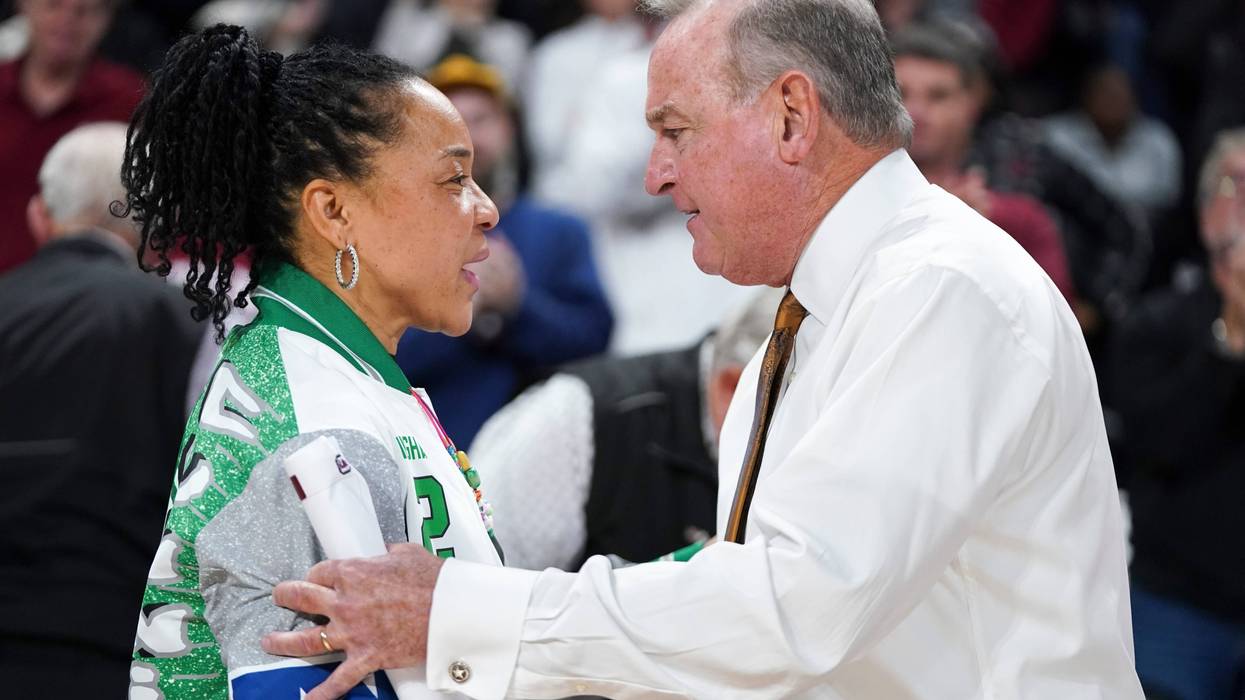 Head coach Dawn Staley of the South Carolina Gamecocks, left, and head coach Vic Schaefer of the Texas Longhorns talk after an NCAA women's basketball game at Colonial Life Arena on January 12, 2024, in Columbia, South Carolina.