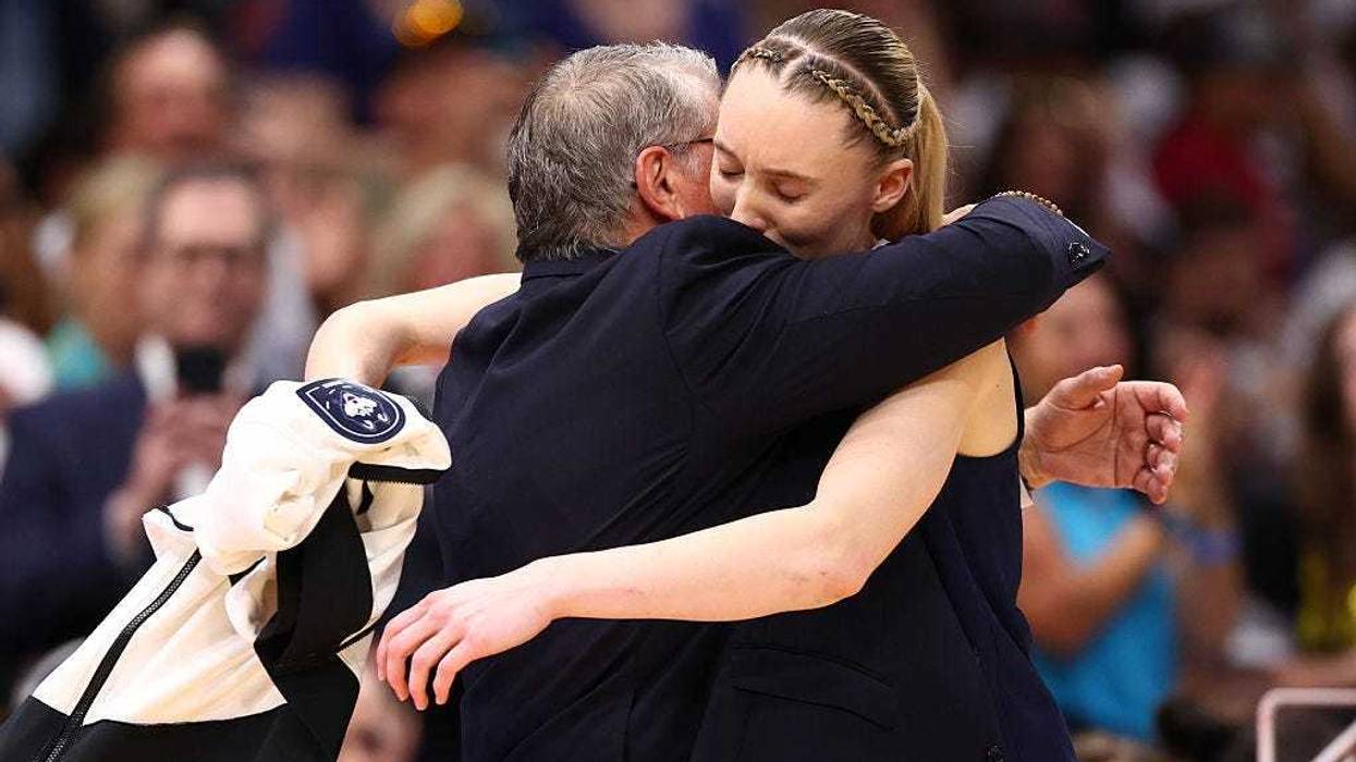 Head coach Geno Auriemma and Paige Bueckers #5 of the UConn Huskies embrace in the fourth quarter against the South Carolina Gamecocks in the National Championship of the NCAA Women's Basketball Tournament at Amalie Arena on April 06, 2025 in Tampa, Florida.