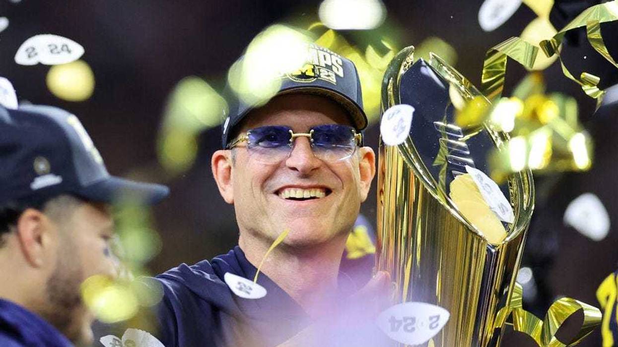Head coach Jim Harbaugh of the Michigan Wolverines celebrates after defeating the Washington Huskies during the 2024 CFP National Championship game at NRG Stadium on January 08, 2024 in Houston, Texas. Michigan defeated Washington 34-13.