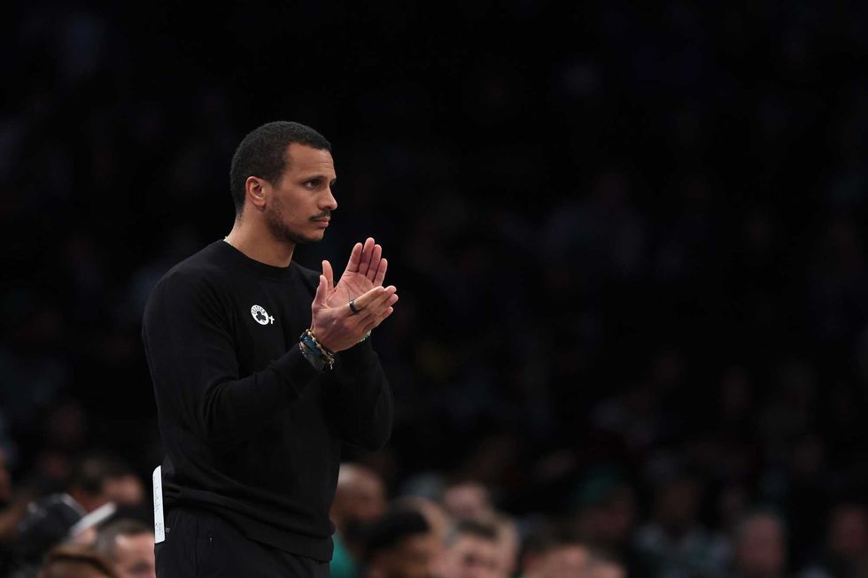 Head coach Joe Mazzulla of the Boston Celtics claps as they play the Brooklyn Nets during the first half at Barclays Center on November 13, 2024 in New York City.