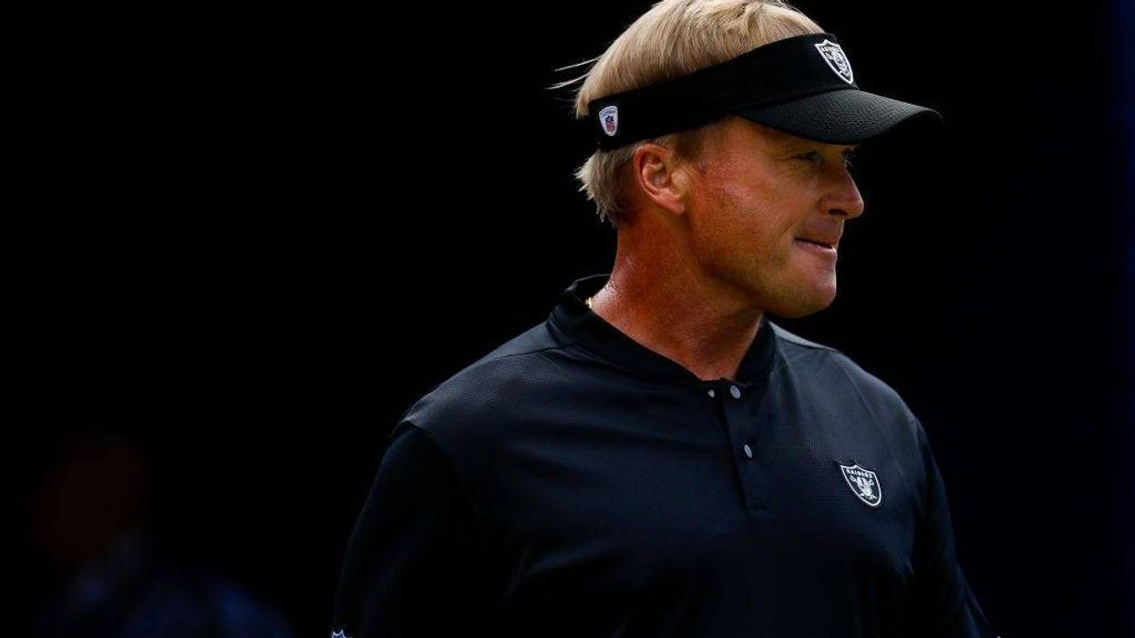Head coach Jon Gruden of the Oakland Raiders walks onto the field before a game at Broncos Stadium at Mile High on September 16, 2018 in Denver, Colorado.