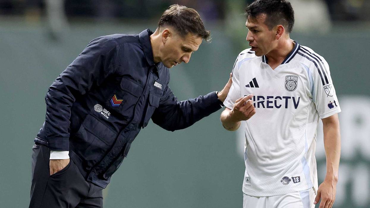 Head coach Mikey Varas of San Diego FC talks with Hirving Lozano #11 of San Diego FC during the 2025 MLS Cup Playoff match between San Diego FC and Portland Timbers at Providence Park on November 01, 2025 in Portland, Oregon