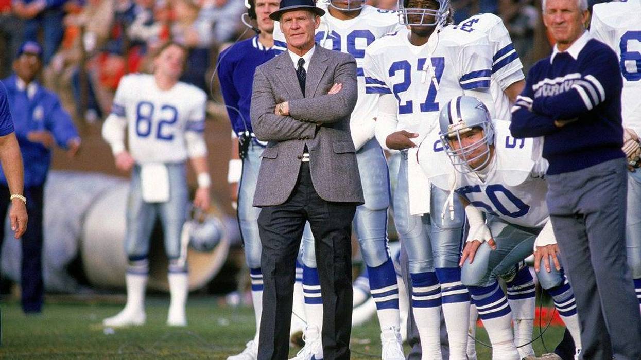Head coach Tom Landry of the Dallas Cowboys watches from the sideline during a game in the 1988 season.